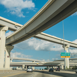 View of a major freeway system near Katy, Texas, with multiple highway lanes and overpasses – cheap car insurance in Texas.