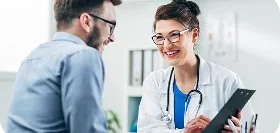 Doctor reviewing health insurance options with a patient