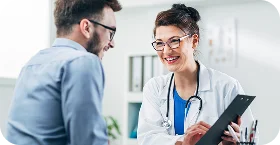 Doctor reviewing health insurance options with a patient