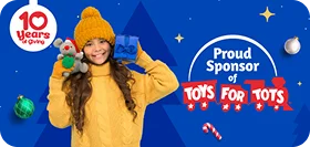 Child holding toys, festive background.