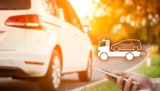 Driver using a smartphone to request roadside assistance for a vehicle on the side of the road, with a tow truck icon overlay, highlighting insurance add-ons like roadside assistance, towing coverage, and emergency breakdown protection.