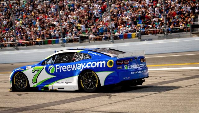 Freeway 500 inaugural race featuring the No. 7 Freeway.com NASCAR car on the track.