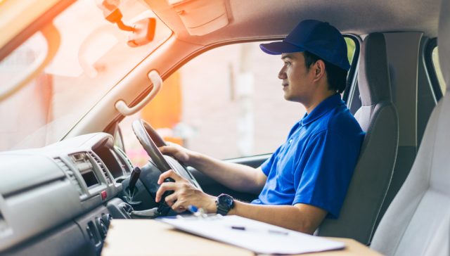 Specialty insurance provider driving a commercial delivery vehicle.